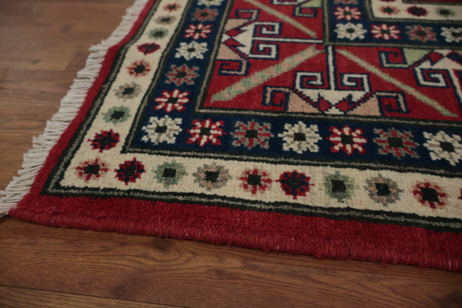 Traditional Red Kazak Rug with Geometric Patterns and Motifs 7x9