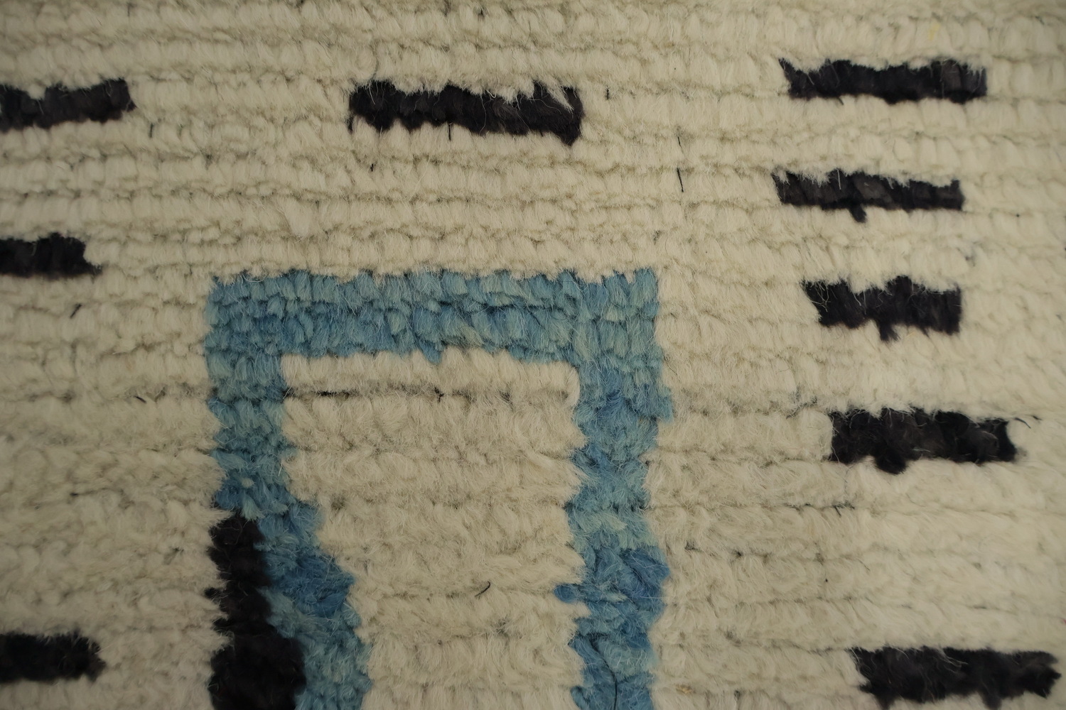 Stylish Neutral-Toned Moroccan Area Rug 7x10 with Artistic Elements