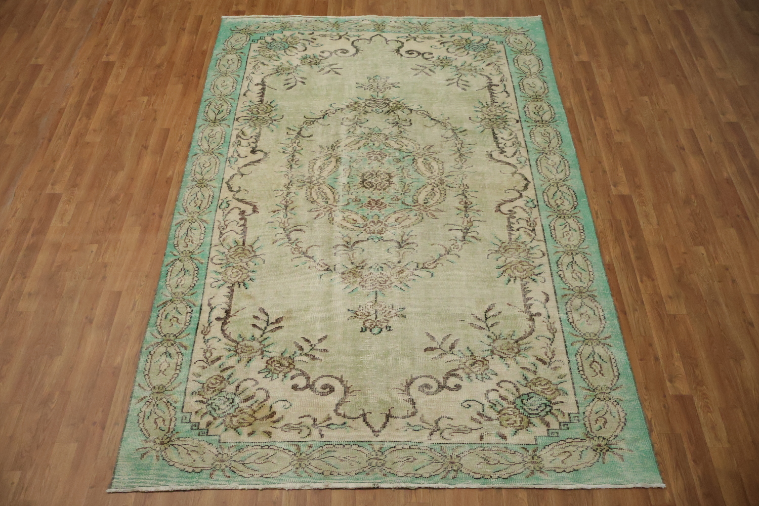 Exquisite Delight: Vintage Green Rug with Ornate Patterns 6x9