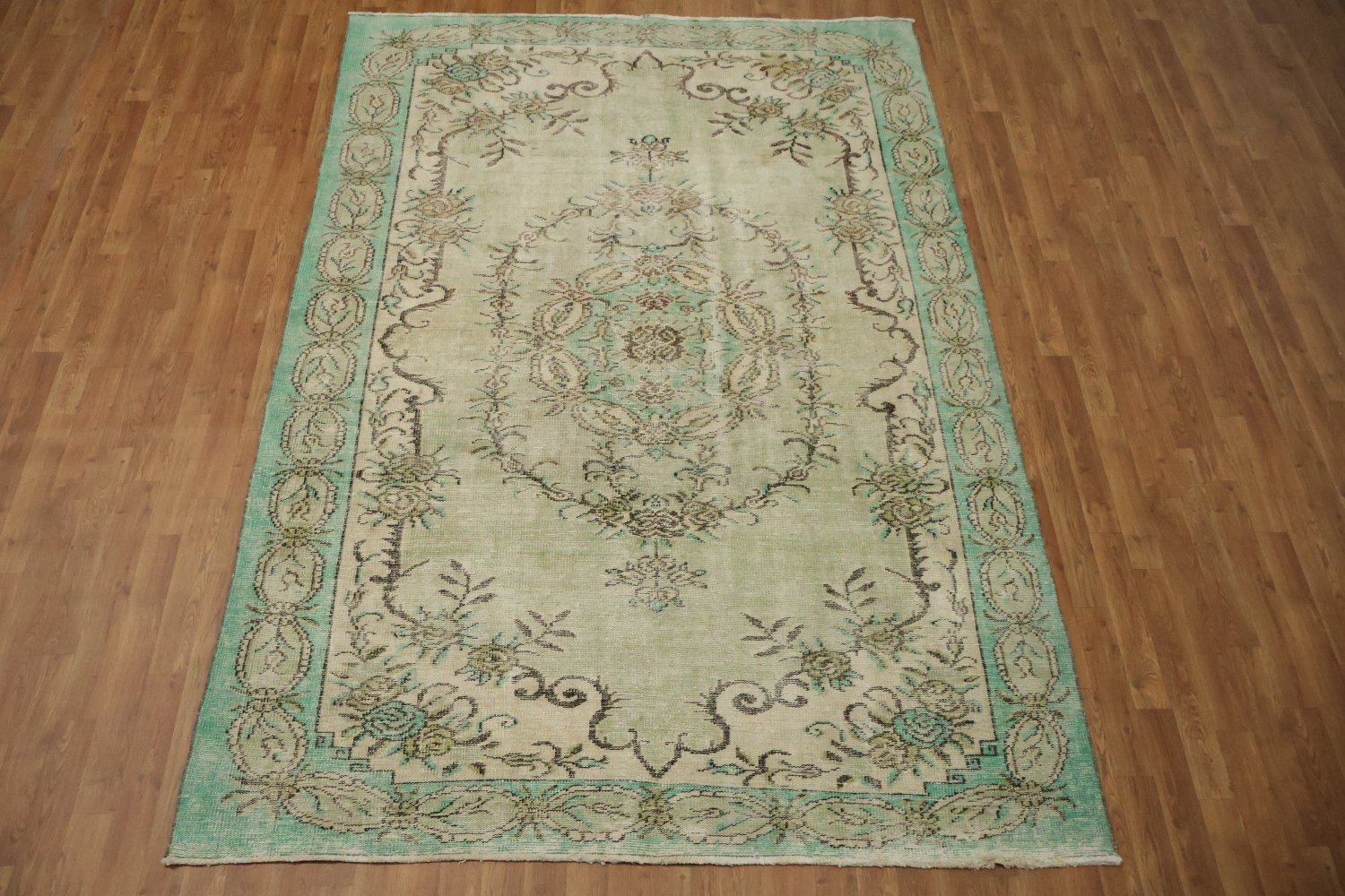 Exquisite Delight: Vintage Green Rug with Ornate Patterns 6x9