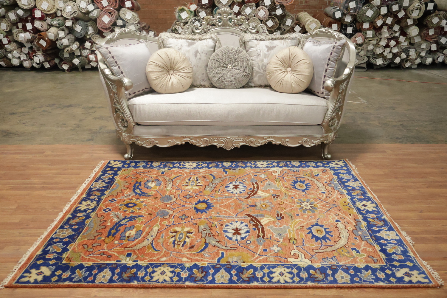 Intricate Floral Orange Rug with Vibrant Blue Border Accent 5'x7'