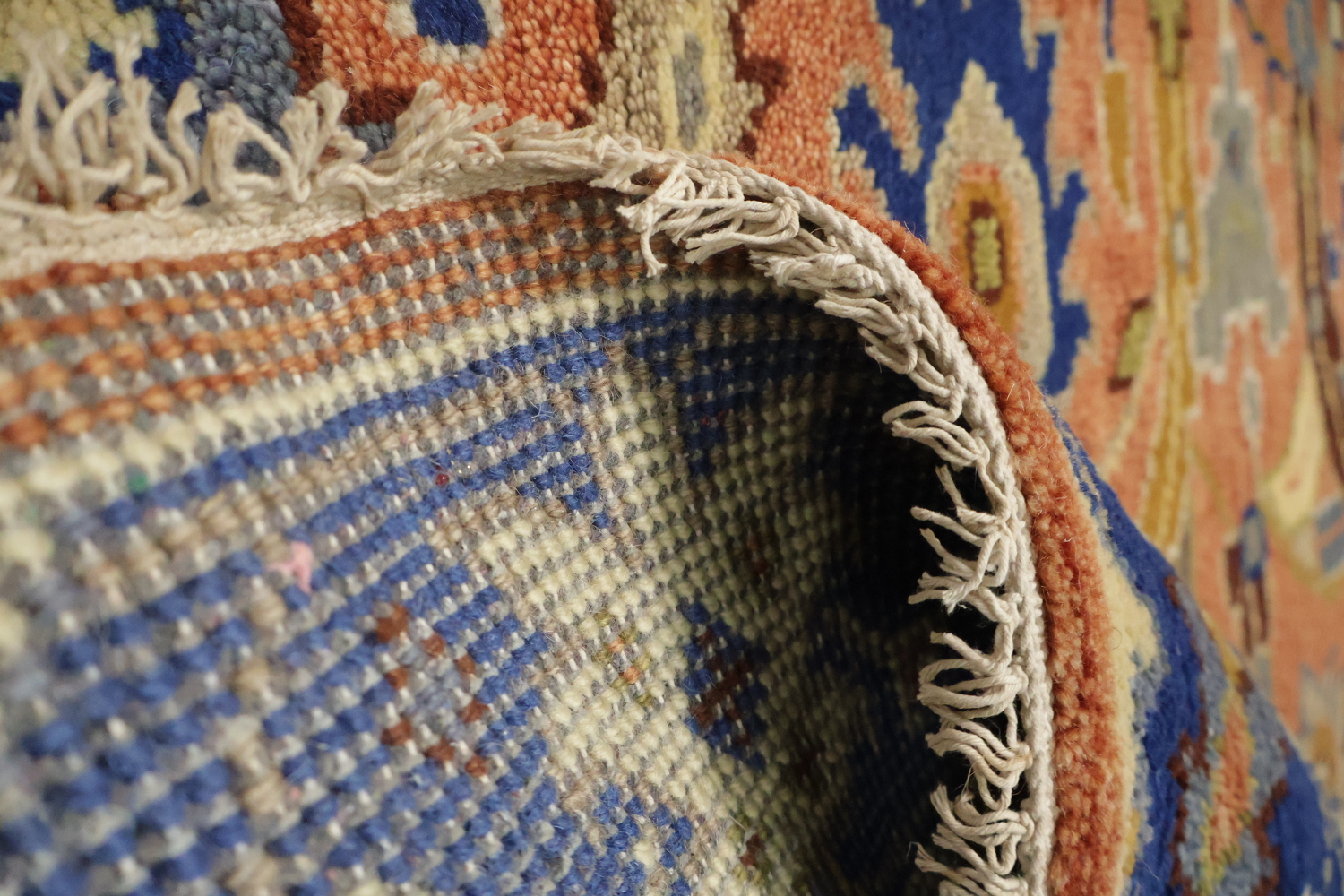 Intricate Floral Orange Rug with Vibrant Blue Border Accent 5'x7'