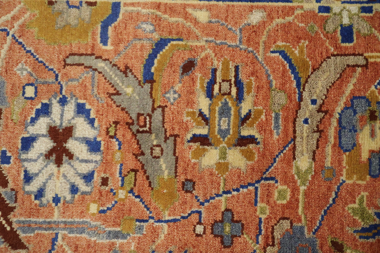 Intricate Floral Orange Rug with Vibrant Blue Border Accent 5'x7'