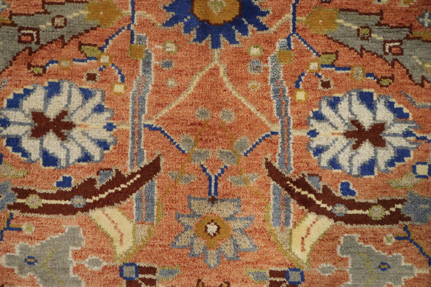 Intricate Floral Orange Rug with Vibrant Blue Border Accent 5'x7'