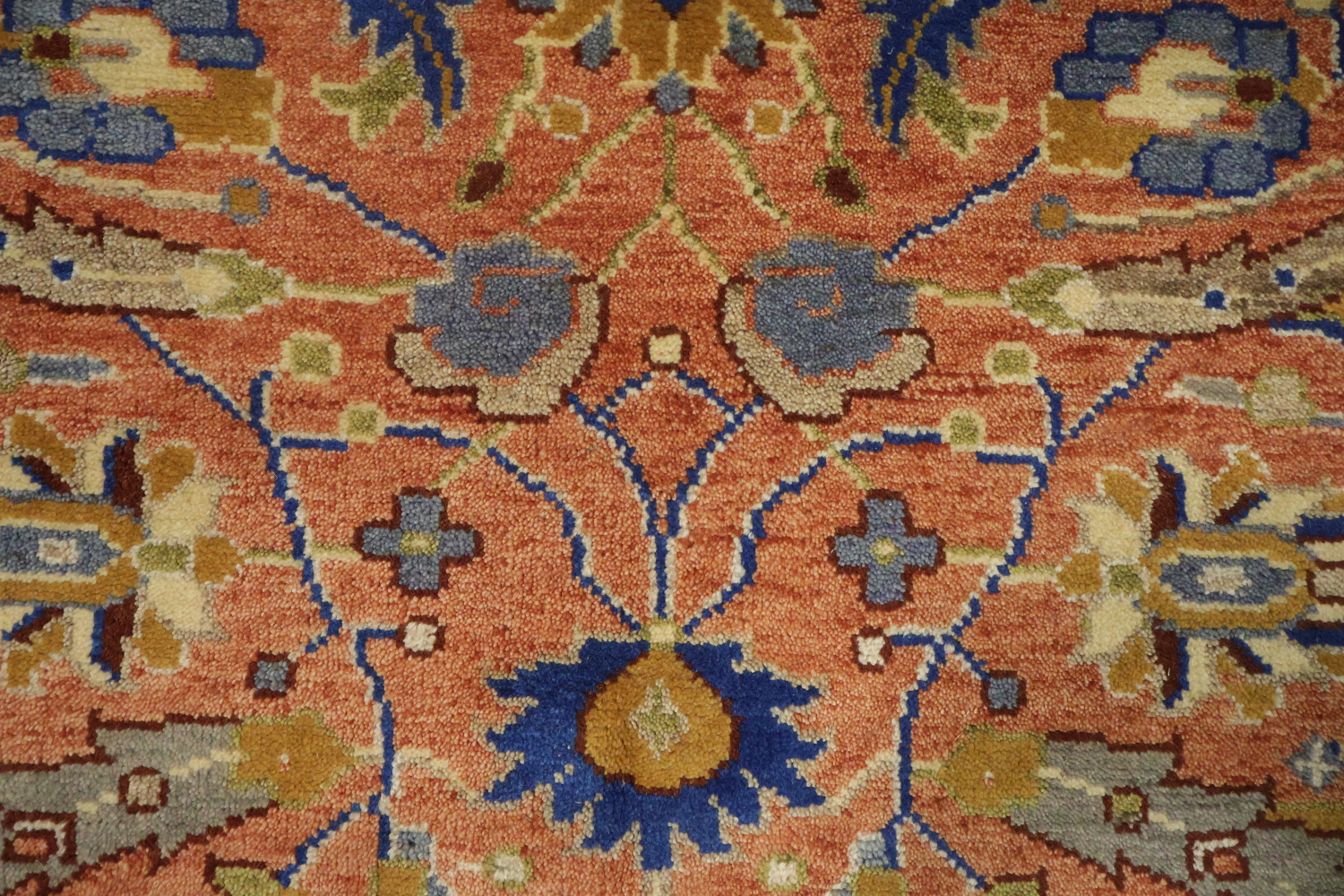 Intricate Floral Orange Rug with Vibrant Blue Border Accent 5'x7'