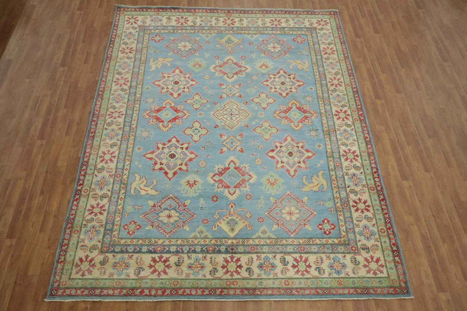 Traditionally designed Kazak Pakistani Rug with blue background 9'x12'