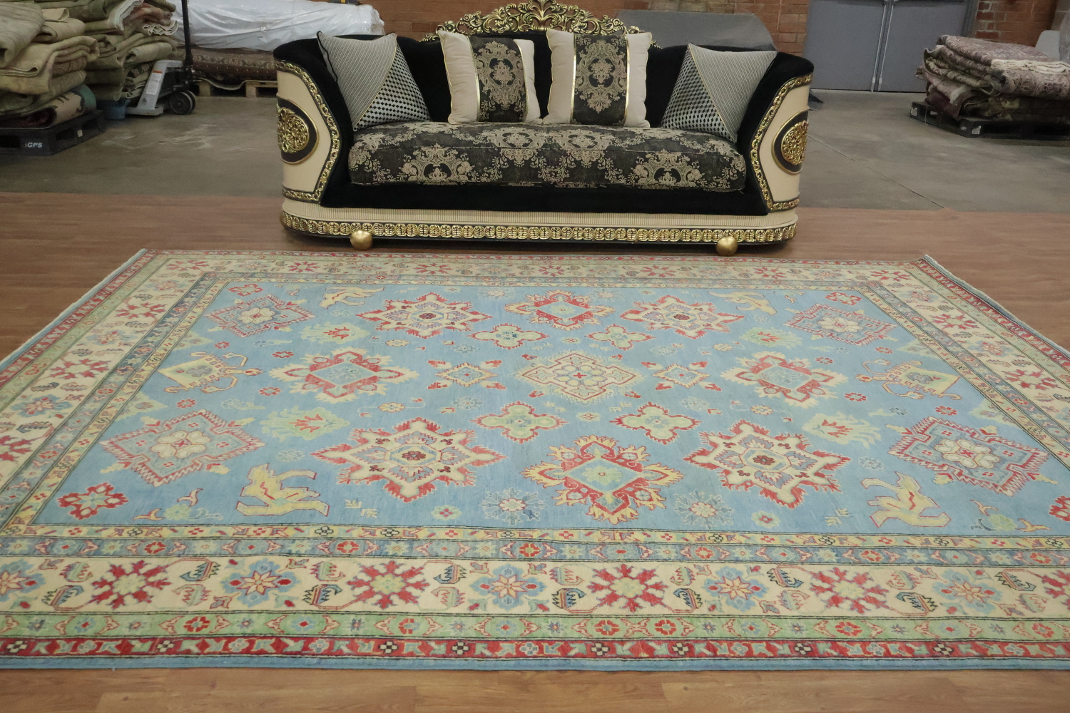 Traditionally designed Kazak Pakistani Rug with blue background 9'x12'