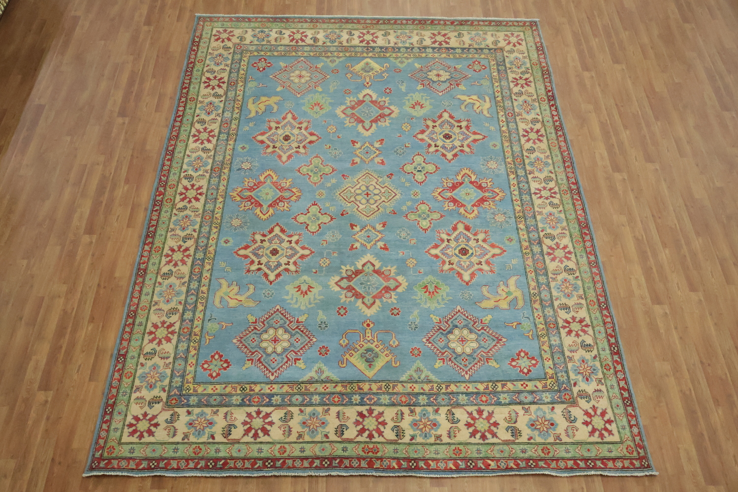 Traditionally designed Kazak Pakistani Rug with blue background 9'x12'