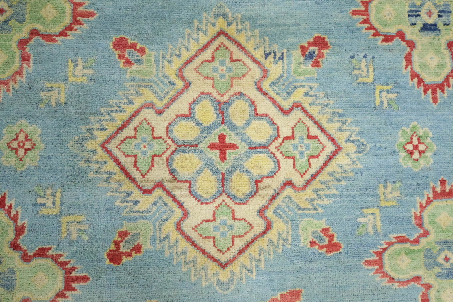 Traditionally designed Kazak Pakistani Rug with blue background 9'x12'