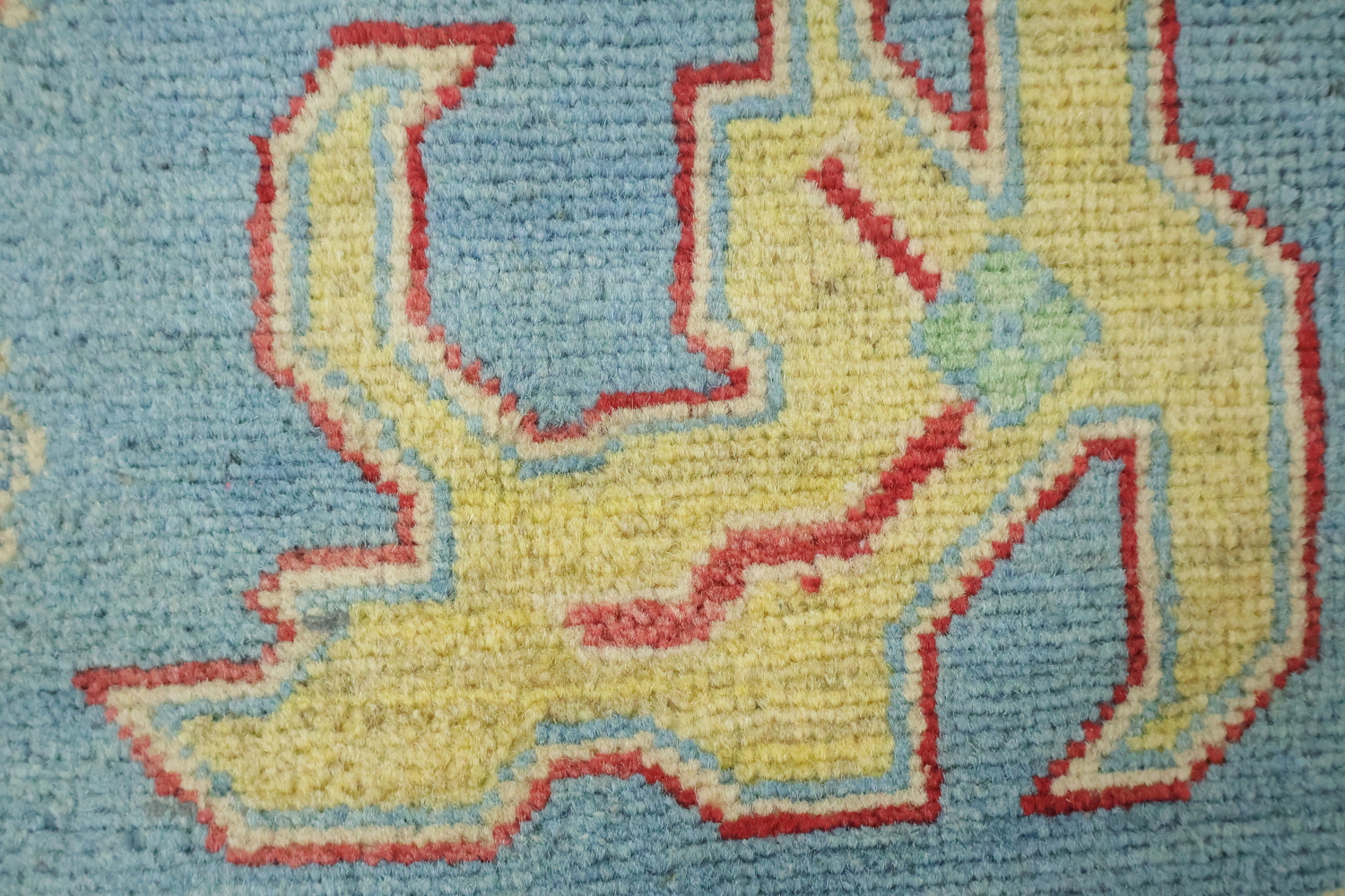 Traditionally designed Kazak Pakistani Rug with blue background 9'x12'