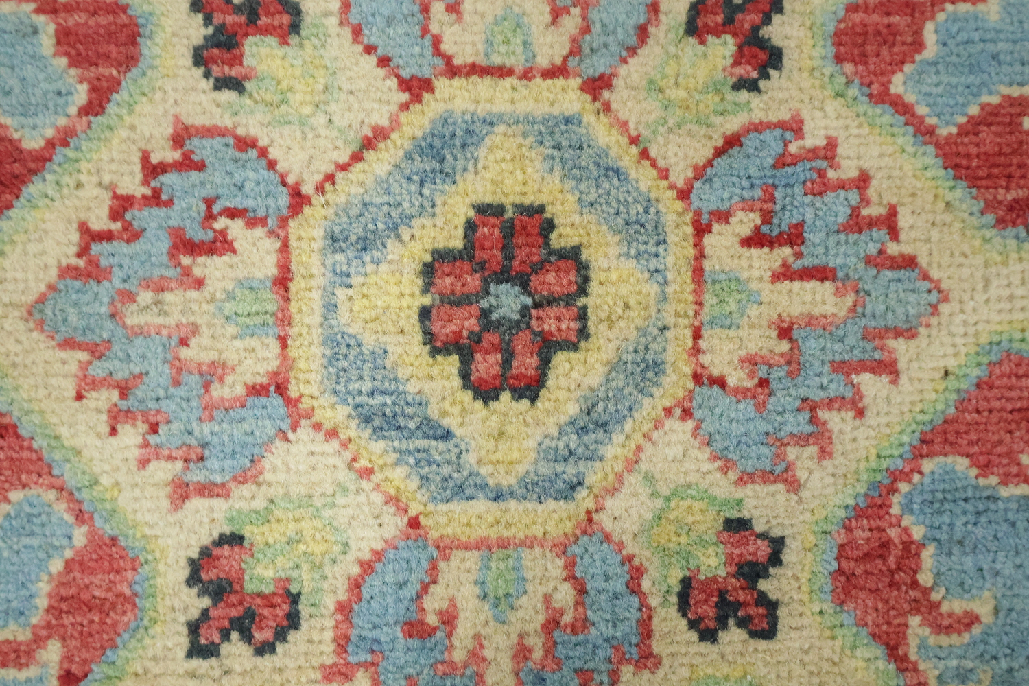 Traditionally designed Kazak Pakistani Rug with blue background 9'x12'