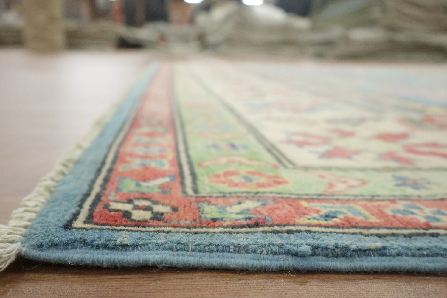 Traditionally designed Kazak Pakistani Rug with blue background 9'x12'