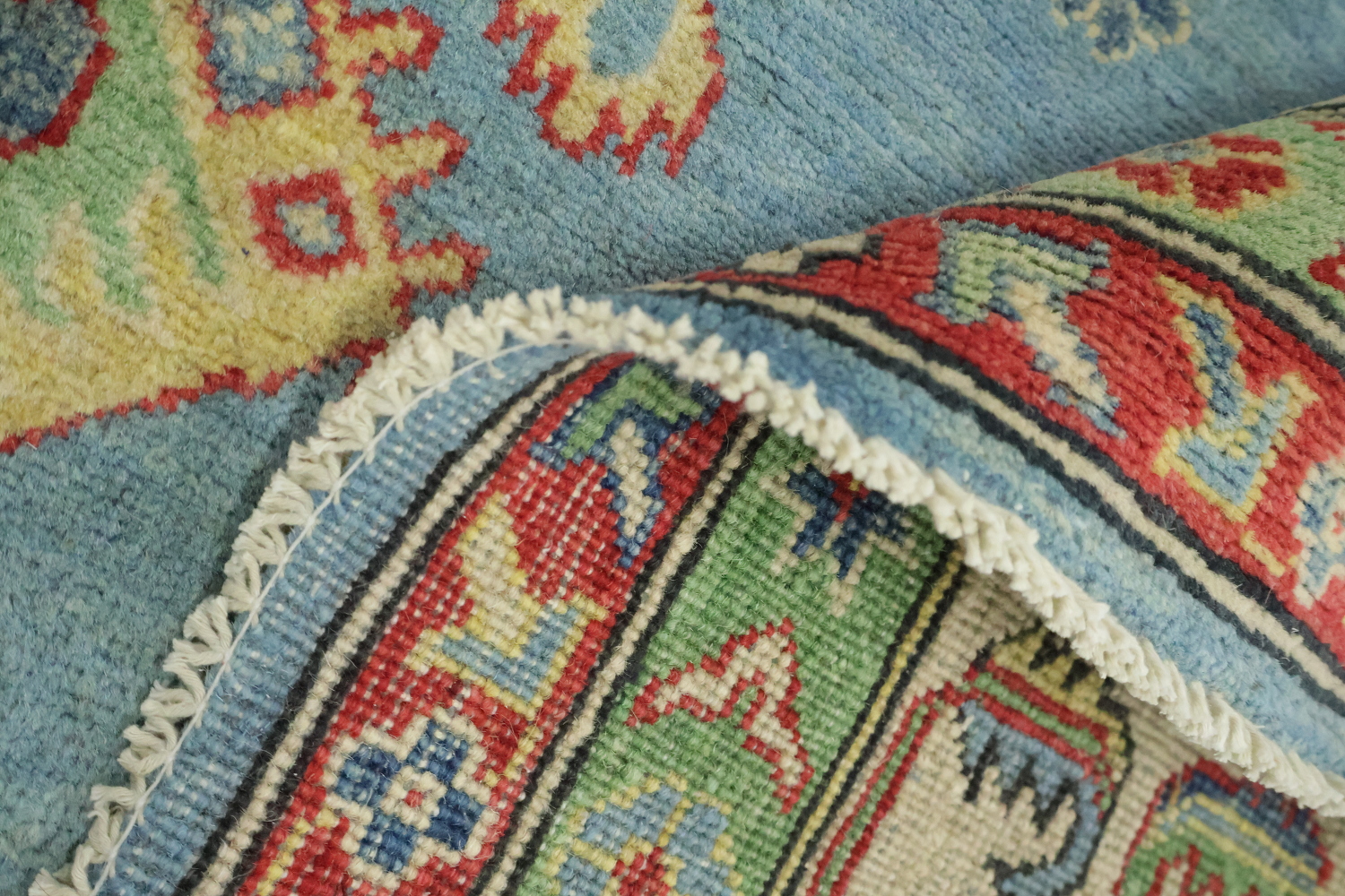 Traditionally designed Kazak Pakistani Rug with blue background 9'x12'