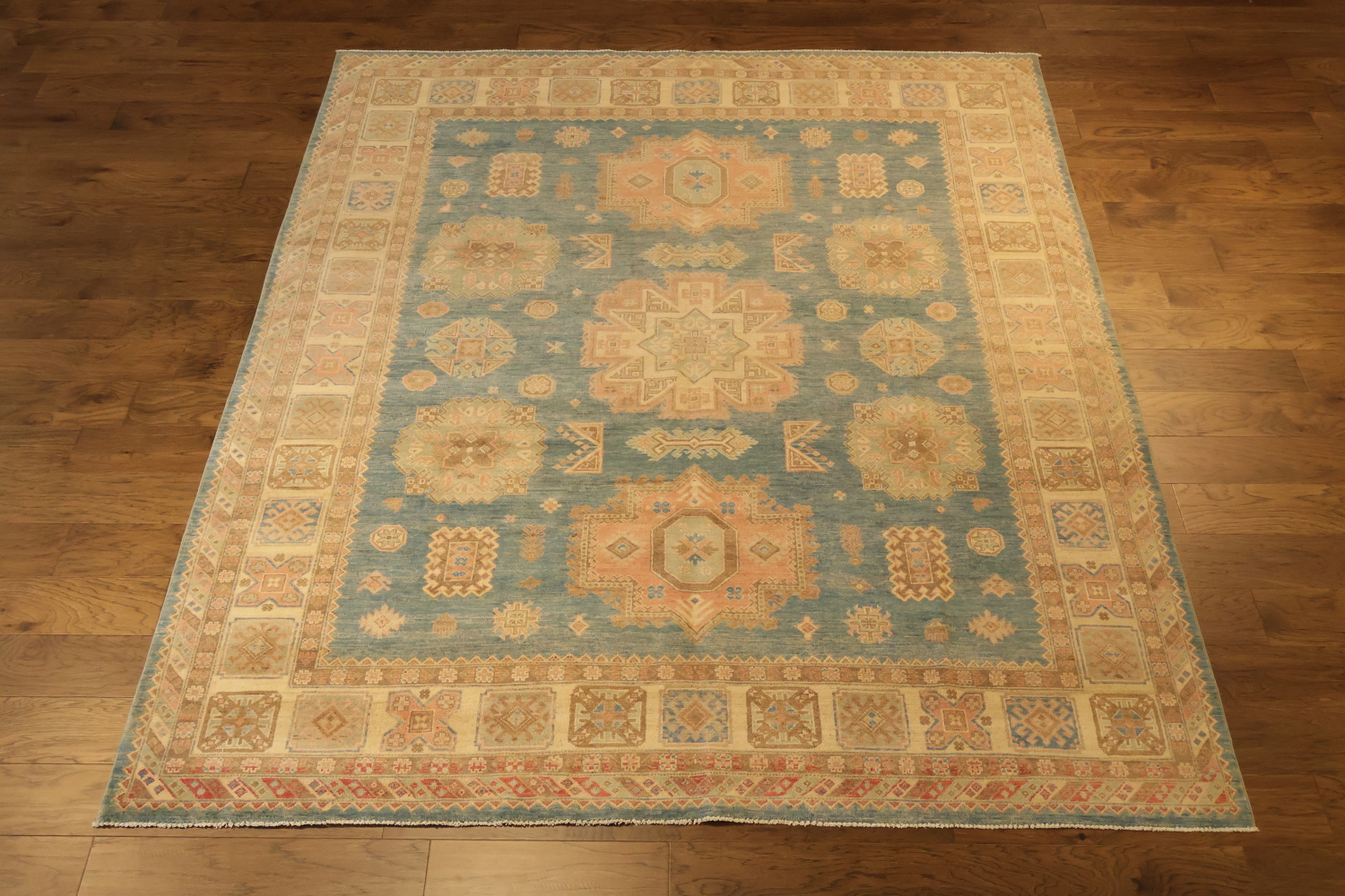 Elegant Persian-inspired rug in muted blue and beige tones for classic decor 8x10