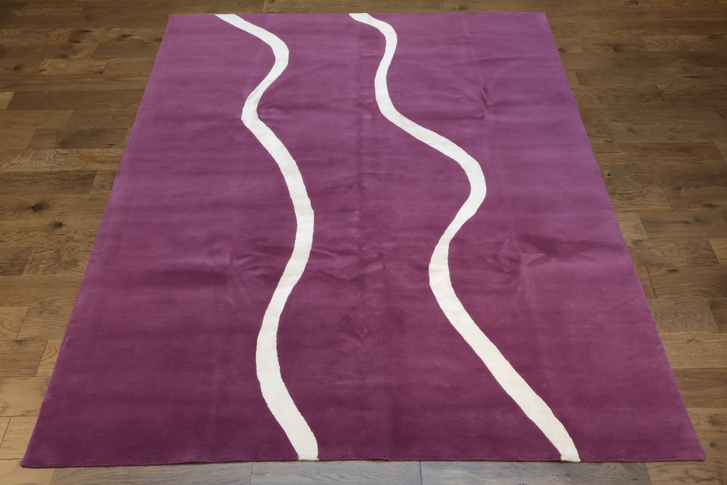 Elegant Purple Nepalese Rug with Wavy White Lines for Modern Interiors 8x10