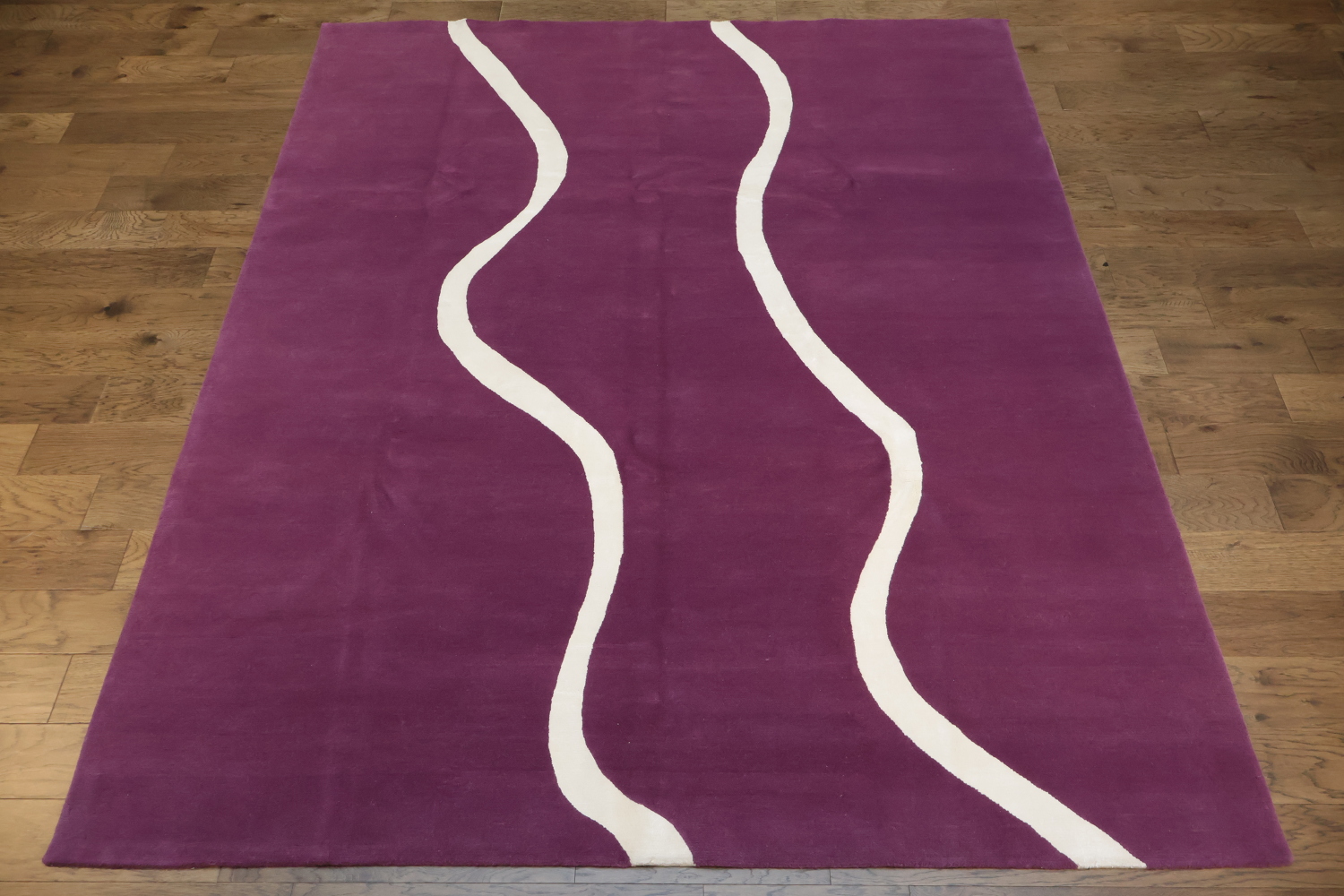 Elegant Purple Nepalese Rug with Wavy White Lines for Modern Interiors 8x10