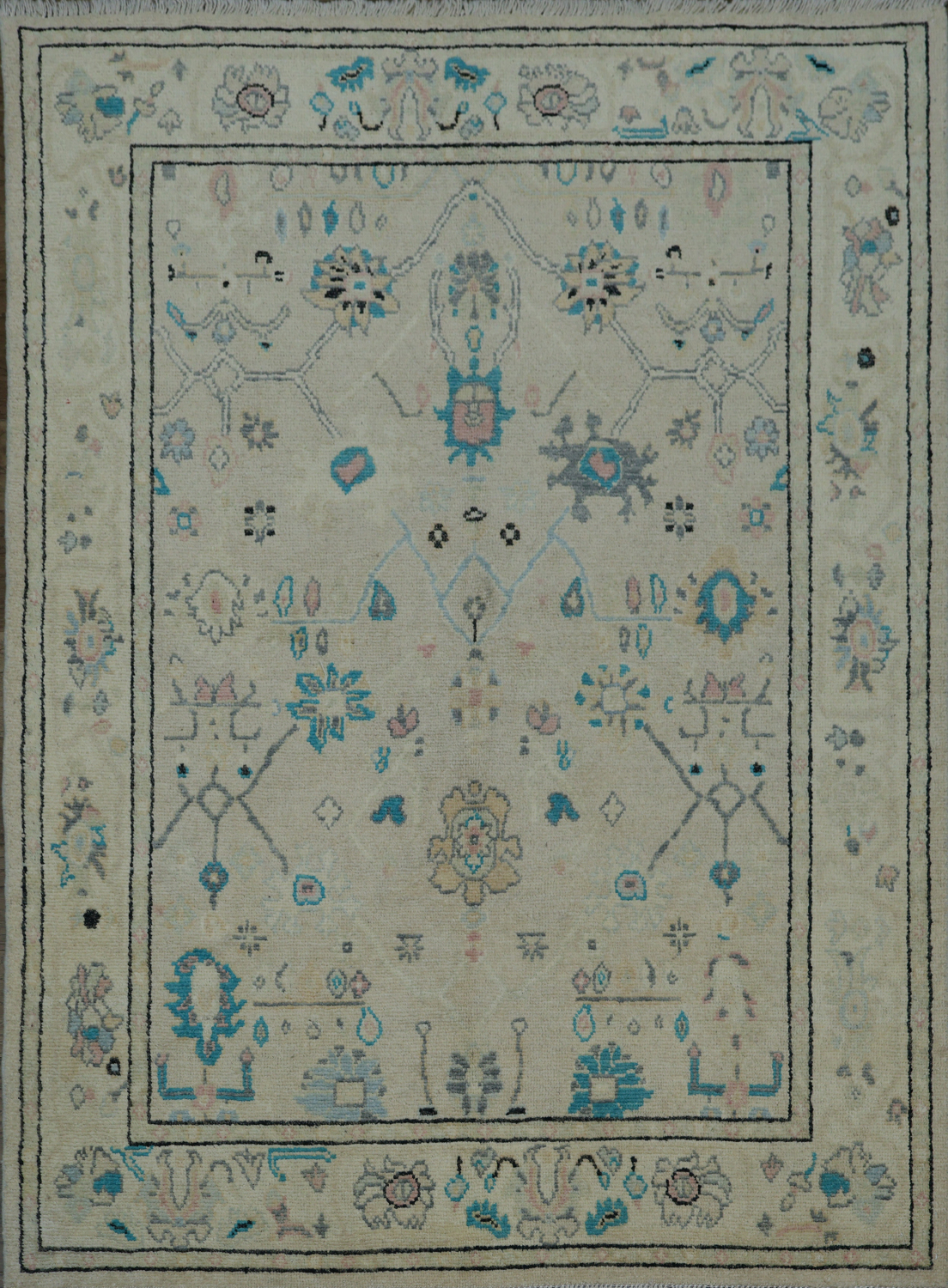 Oushak Turkish Rug with a cream/beige background and blue/turquoise accents 5x6