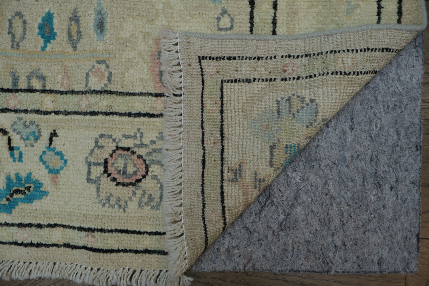 Oushak Turkish Rug with a cream/beige background and blue/turquoise accents 5x6