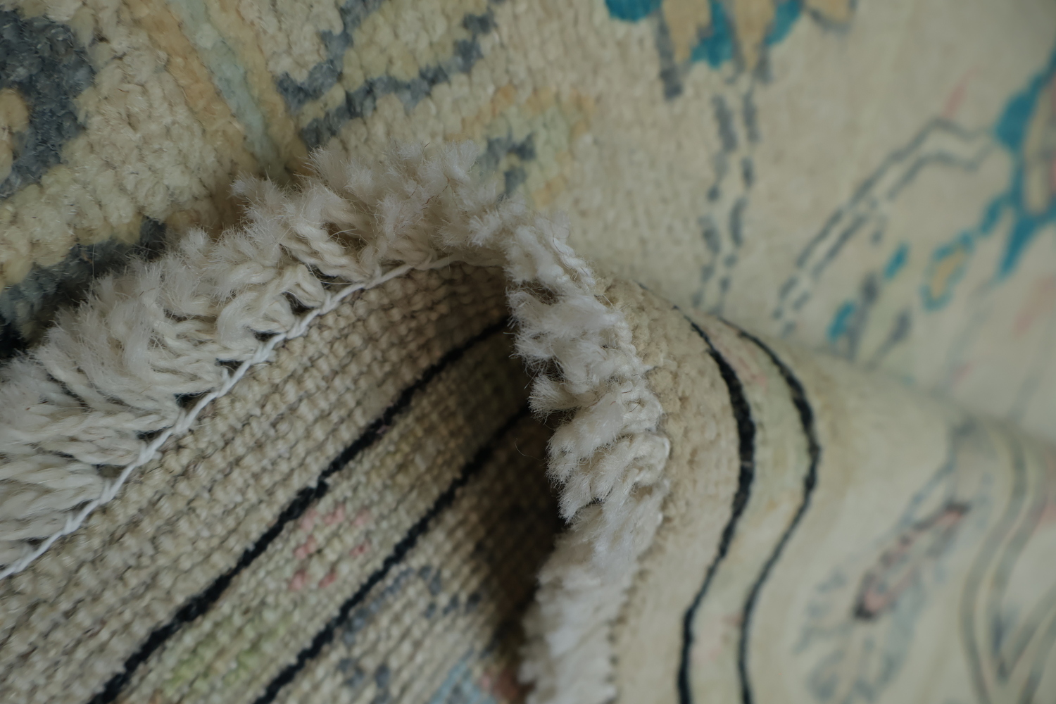 Oushak Turkish Rug with a cream/beige background and blue/turquoise accents 5x6