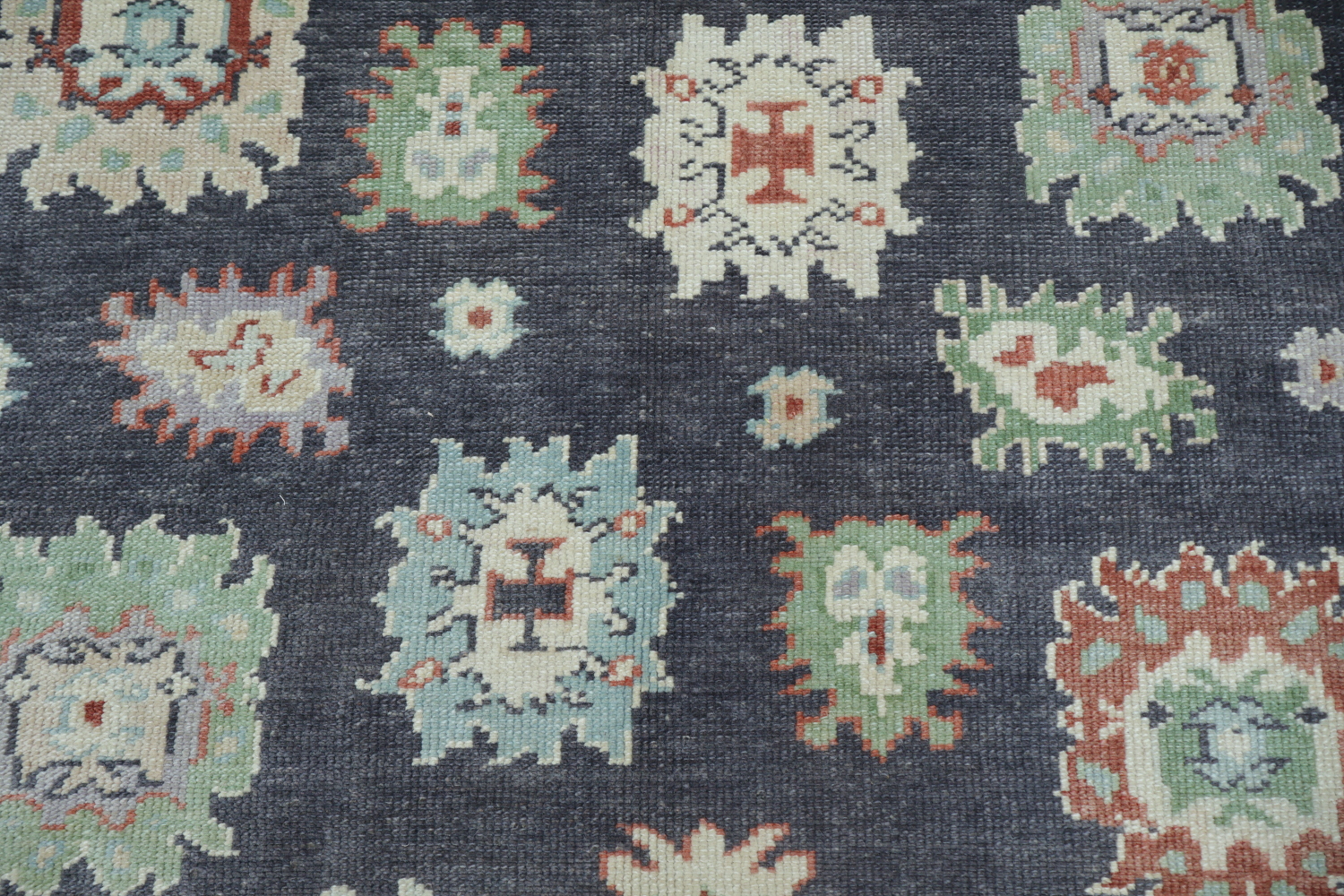 Muted Navy Blue Oushak Turkish Wool Rug with Vibrant Floral Patterns and Border 6x9