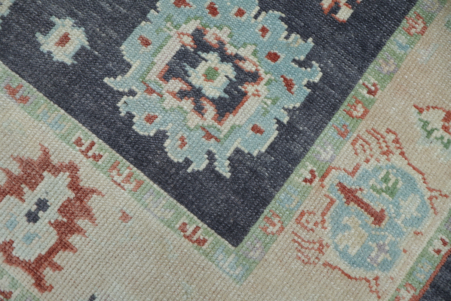 Muted Navy Blue Oushak Turkish Wool Rug with Vibrant Floral Patterns and Border 6x9
