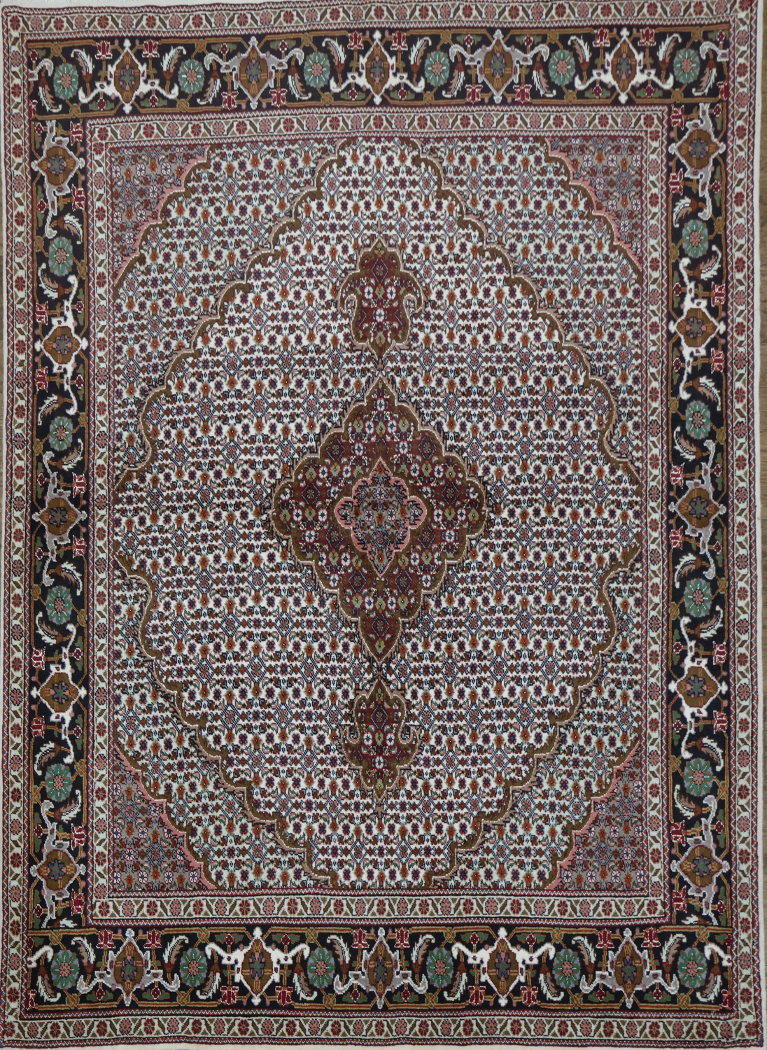 Wool and Silk Persian Tabriz Mahi design Area rug with an ivory field and Black Border 5x7
