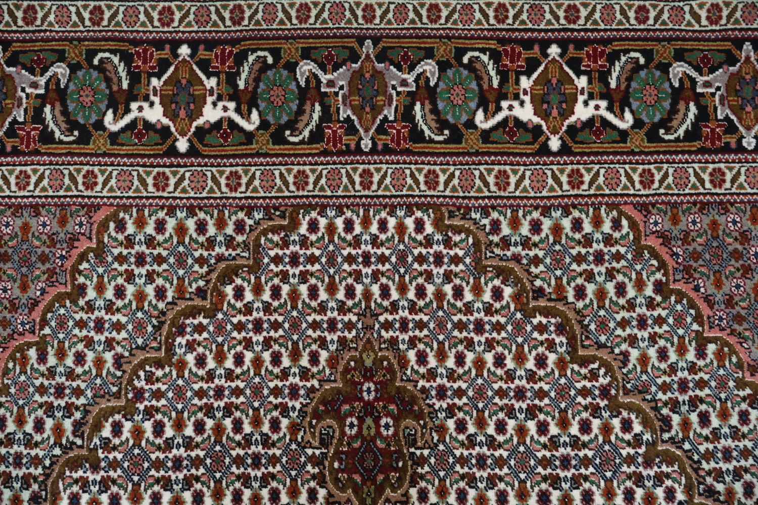 Wool and Silk Persian Tabriz Mahi design Area rug with an ivory field and Black Border 5x7