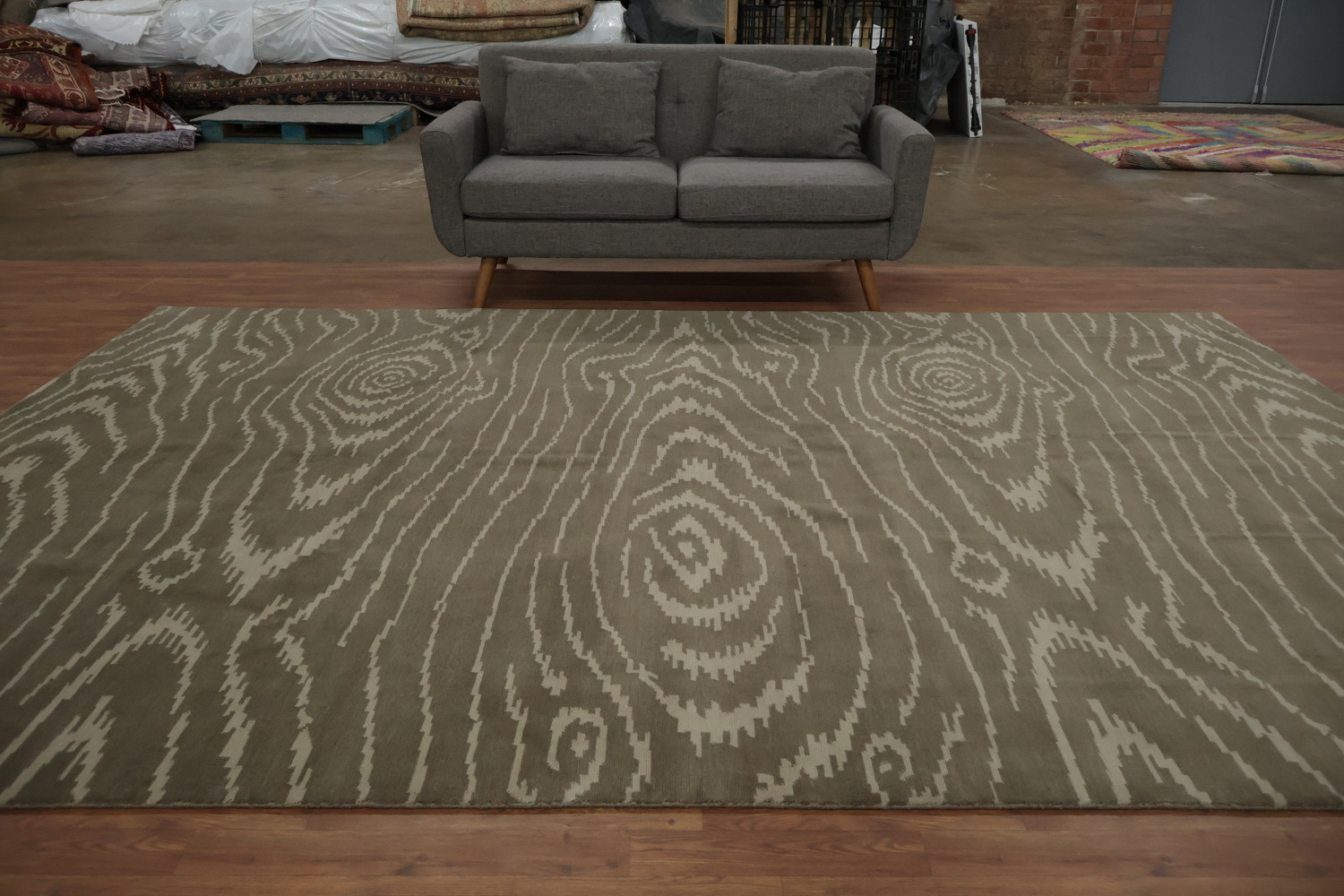 Modern Serenity: Neutral Tones Rug with Hypnotic Design 8x12