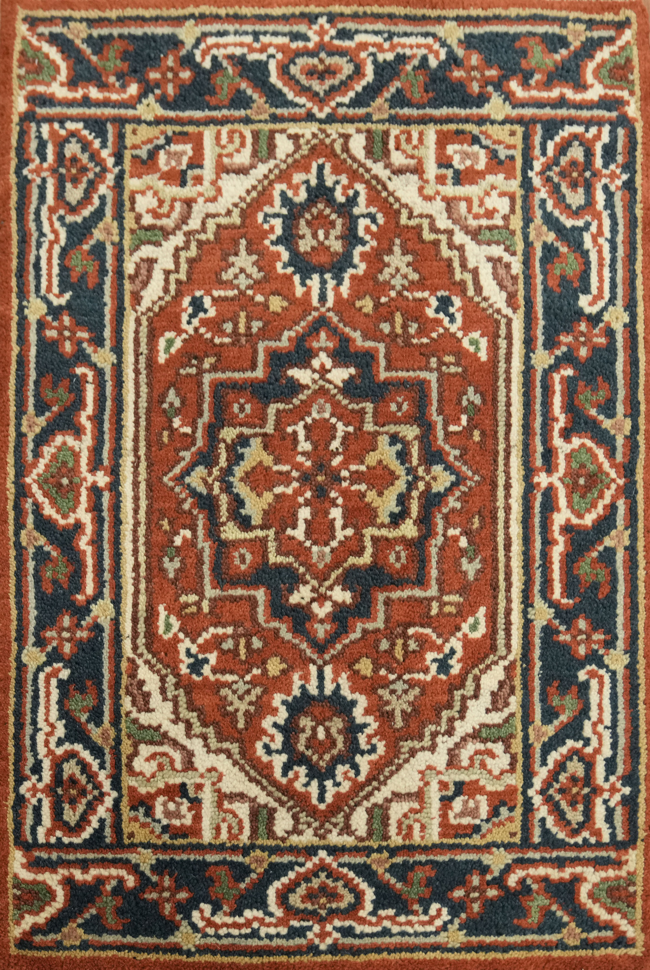 Earth Toned 2×3 Oriental Wool Accent Rug with Geometric Rust & Blue Design