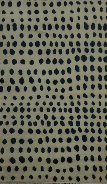 Sleek Moroccan Area Rug 5x8 with Bold Black Polka Dot Details
