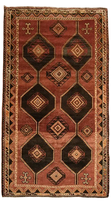 Warm Tones and Geometric Charm in Vintage Tribal Rug 5'x9'
