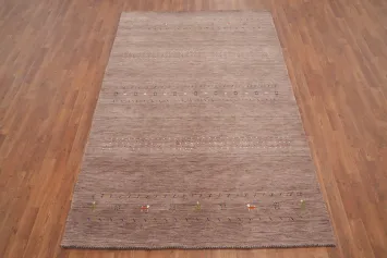 Elegant Earthy Tones in a Textured Gabbeh Area Rug 5x8