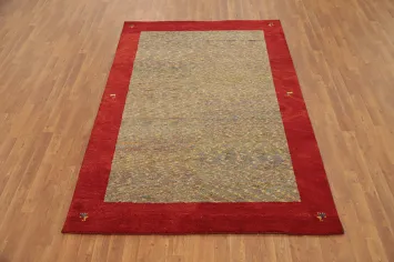 Sophisticated Gabbeh Area Rug 5x8 with Textured Center and Red Frame