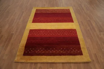 Luxurious Red and Gold Gabbeh Rug 5x7 for Elegant Interiors