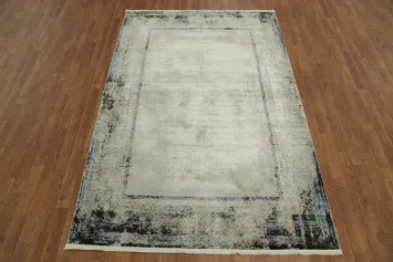 Modern rectangular area rug featuring abstract border patterns 5x8