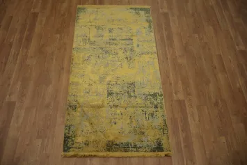 Vintage-style rug with distressed gold and blue abstract patterns 3x5