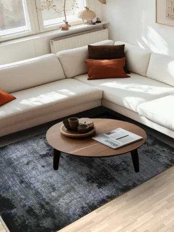 Contemporary Artistry: Black and Blue Rug with Subtle Elegance