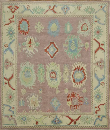 Lavender pink base Oushak Turkish Rug with muted pastel and bold floral motifs 8x10