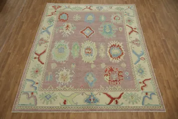 Lavender pink base Oushak Turkish Rug with muted pastel and bold floral motifs 8x10