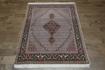 Wool and Silk Persian Tabriz Mahi design Area rug with an ivory field and Black Border 5x7