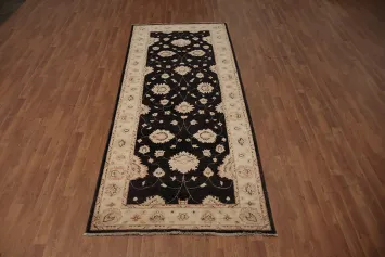 Handcrafted Black Runner Rug with Intricate Beige Floral Accents 4x10