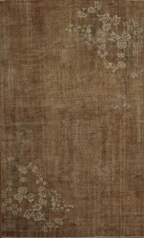 Vintage-Inspired Floral Design on a Distressed Turkish Rug 5x9
