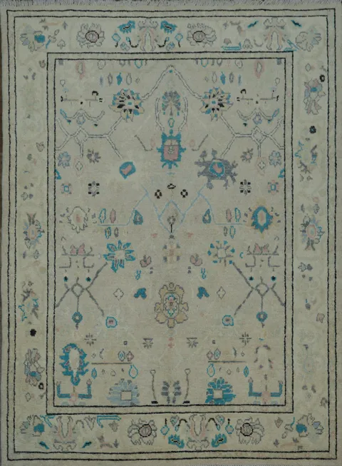 Oushak Turkish Rug with a cream/beige background and blue/turquoise accents 5x6
